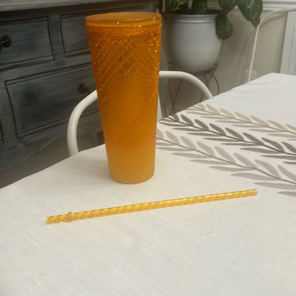 Yellow/orange Starbucks cup